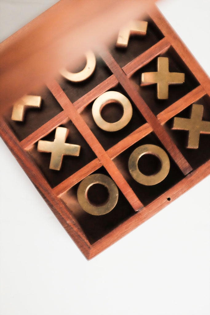 Strategy Tic-Tac-Toe Game With Brass Ornaments In A Wooden Box